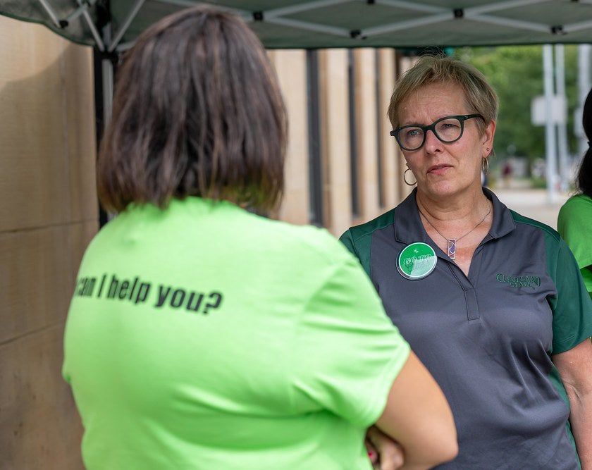 President Laura Bloomberg and a volunteer