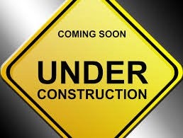 Yellow under construction sign