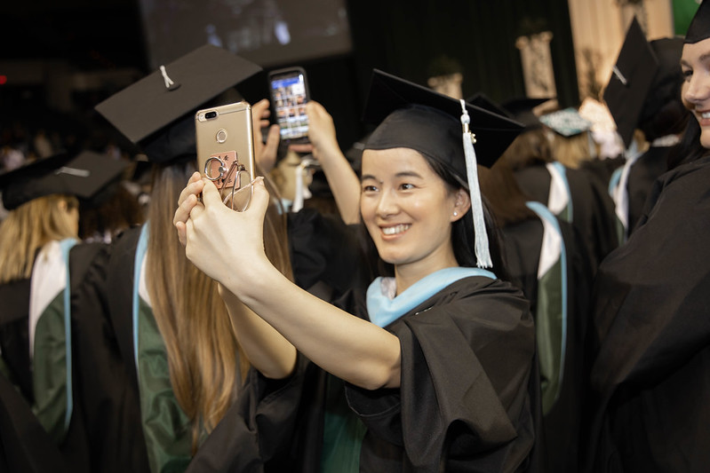 Girl at Commencement with phone