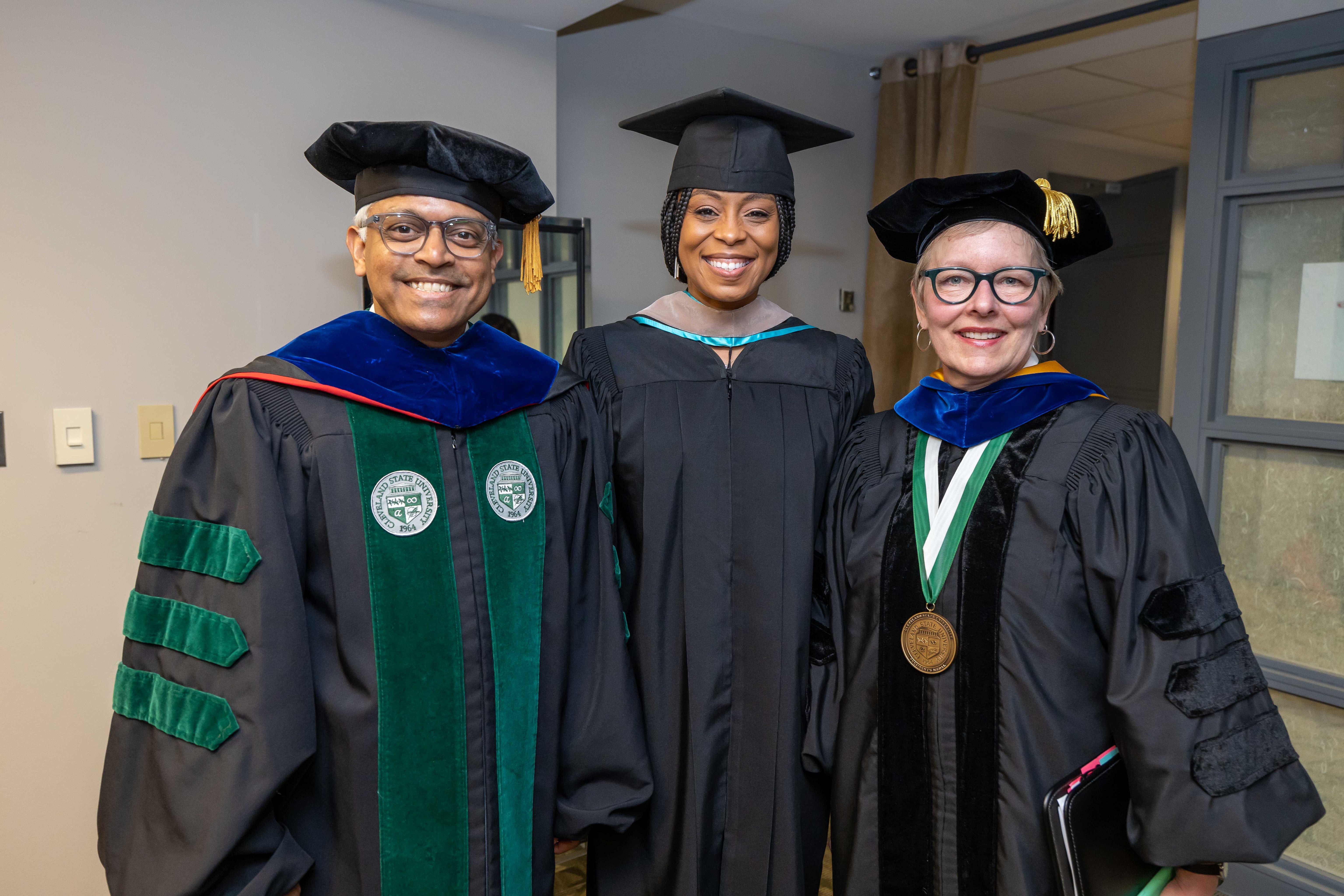 Provost Sridhar, Rep. Brown, President Bloomberg in regalia