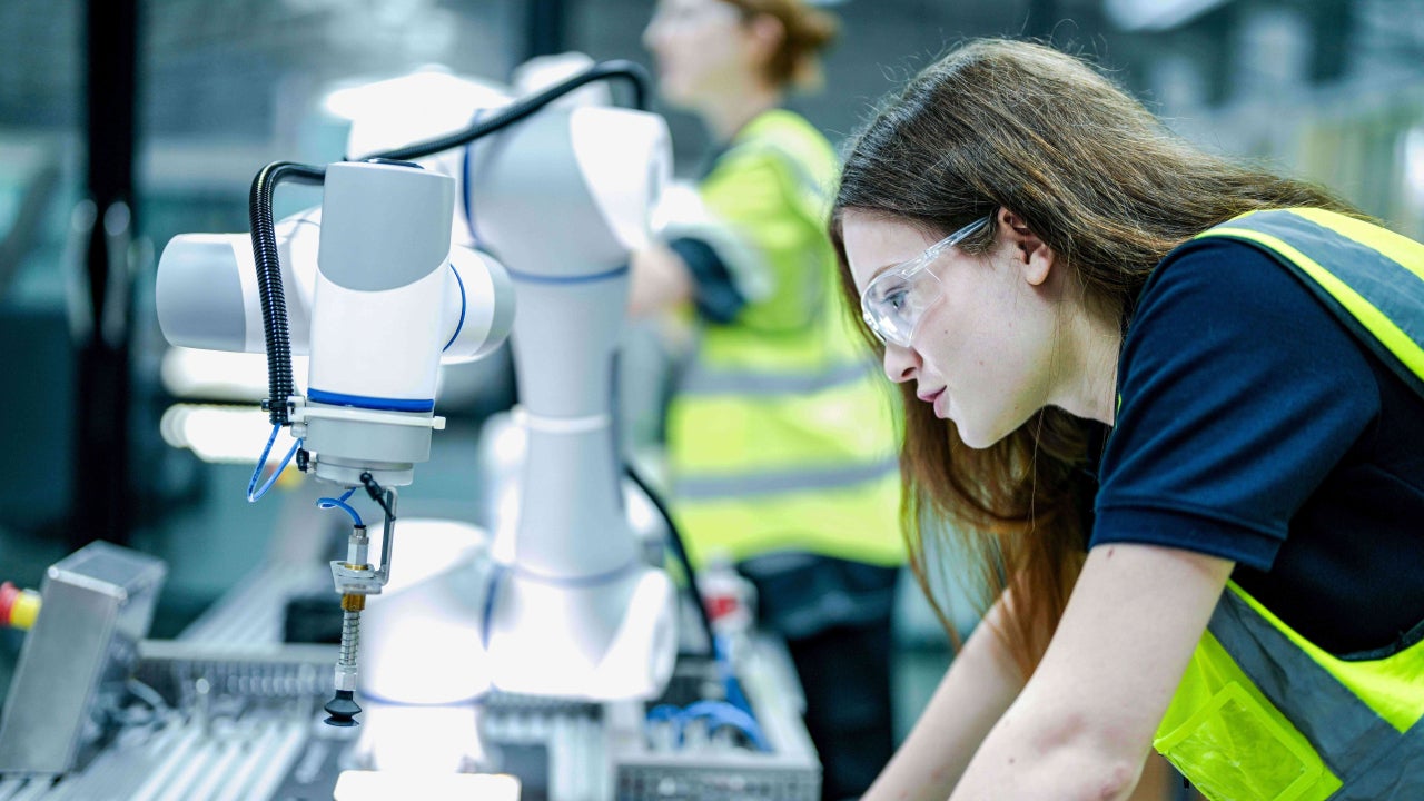 Woman working in manufacturing using smart technology