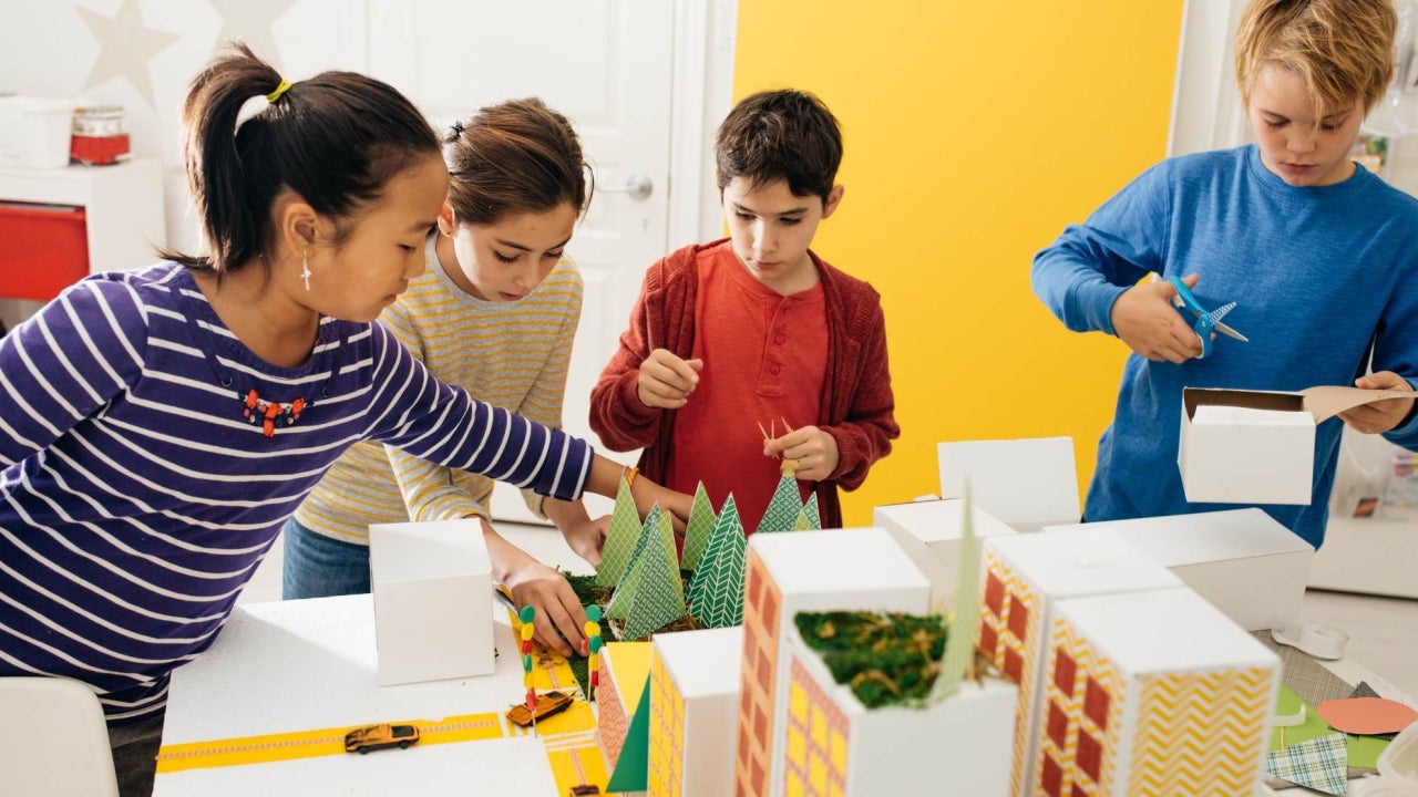 Young students in a classroom working on a project together