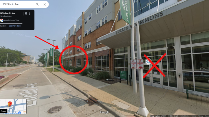 Exterior of University Marketing with the entrance door indicated
