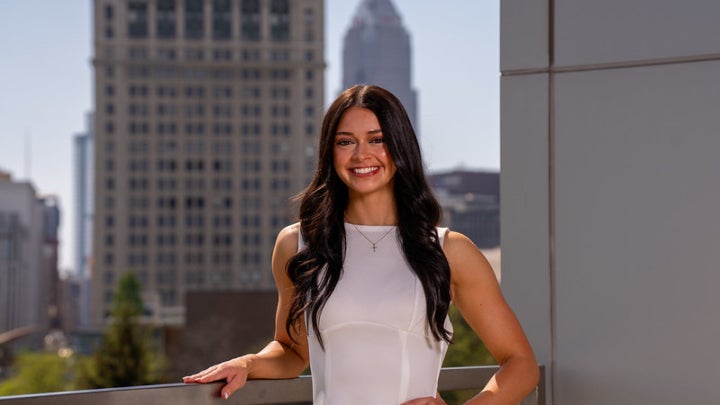 Sydney Wisno posing in front of CSU skyline