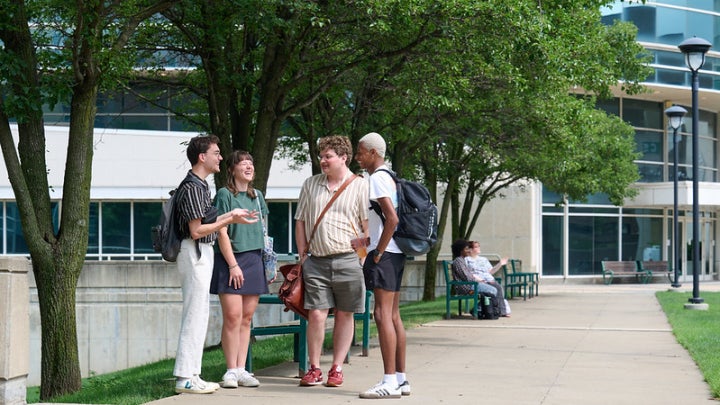 Students standing in front of Levin.
