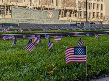 American flags decorating the campus green