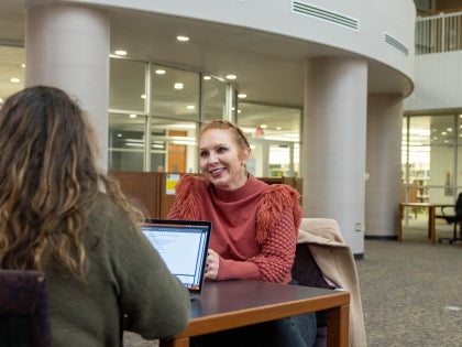 Female students studying at a table