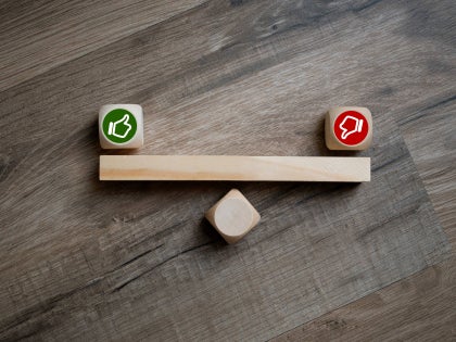 Image of a thumbs up and a thumbs down indicating undecided.
