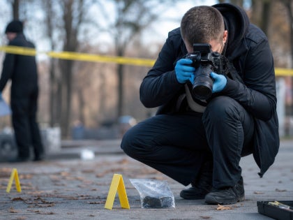 Forensic photographer at a crime scene