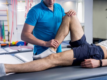 physical therapist working on a client