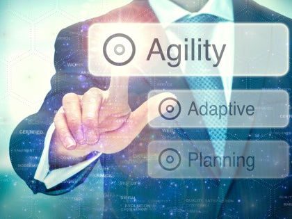 Man using smart technology to identify adaptive manager competencies