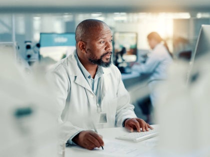 Health care professional, male working in a lab