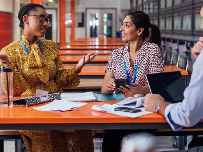 Teachers at a table talking